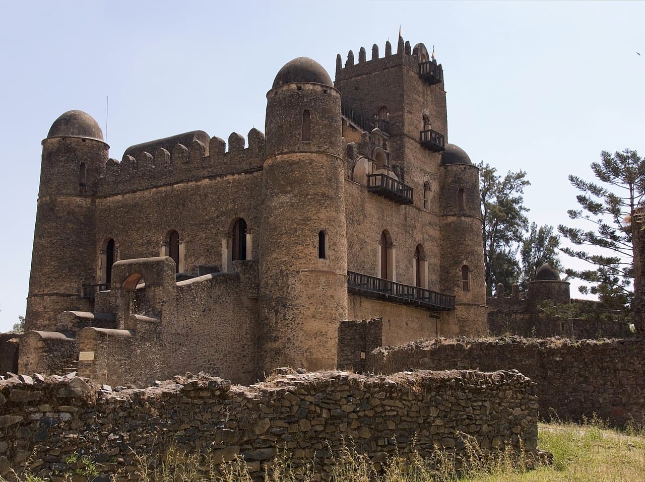 Fasilides' Castle in Gondar, with its domed towers and battlements behind a low stone wall