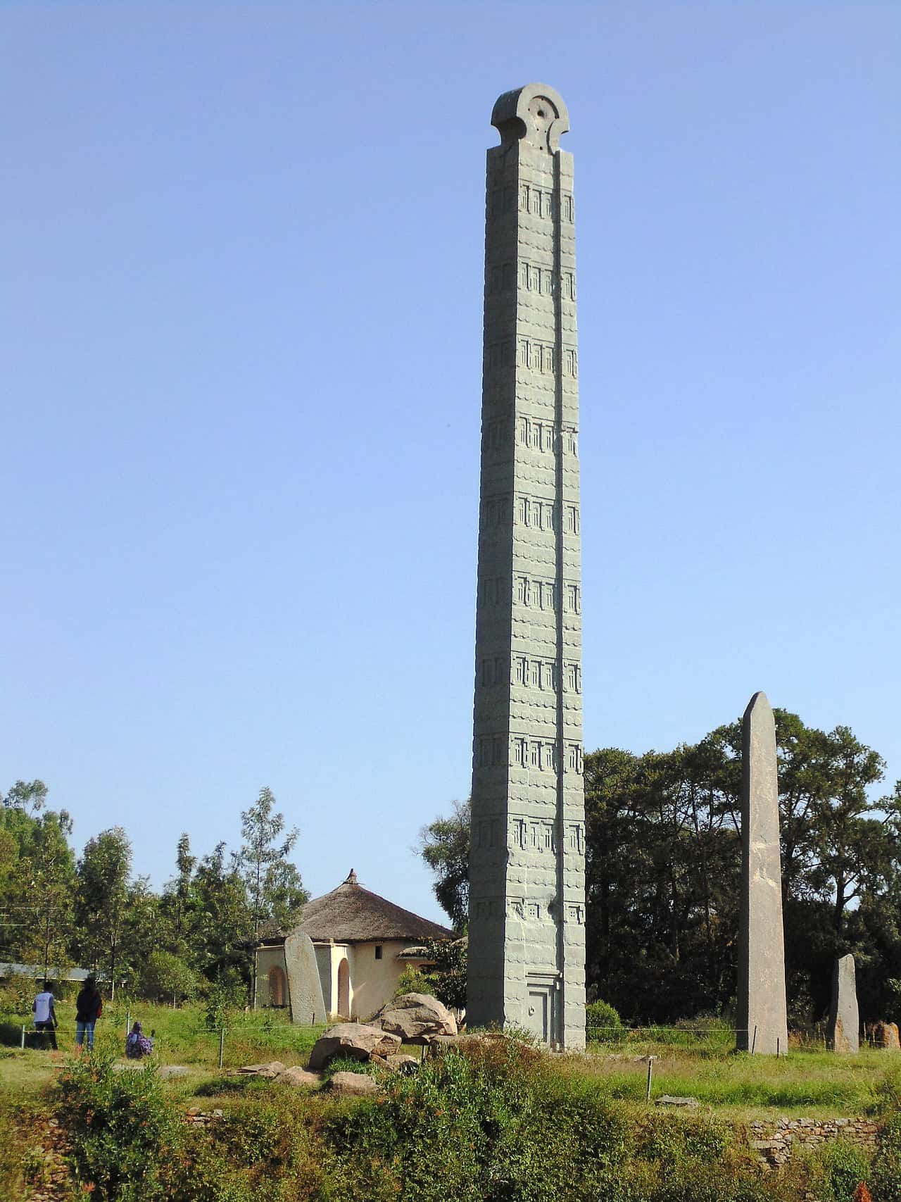 The Obelisk of Aksum, carved to look like a multi-storey building, against a blue sky